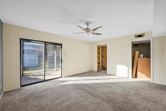 carpeted empty room featuring ceiling fan