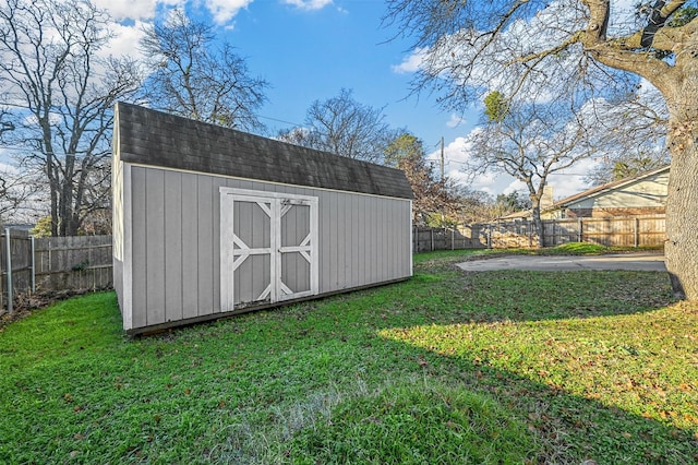 view of outdoor structure with a lawn