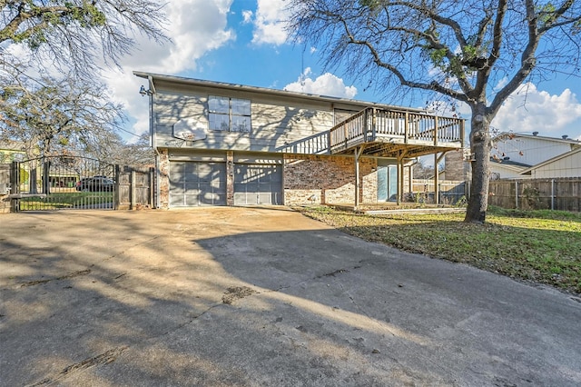 view of front of house with a deck and a garage