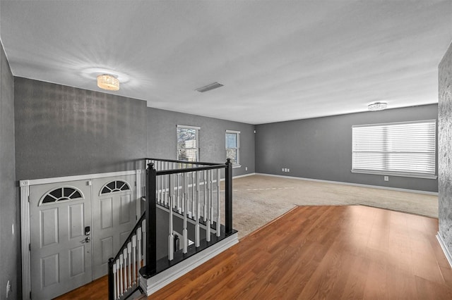 hallway with carpet floors