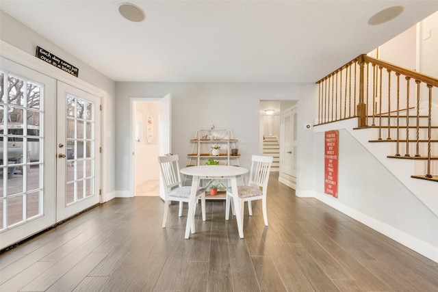 dining room featuring dark hardwood / wood-style floors and french doors