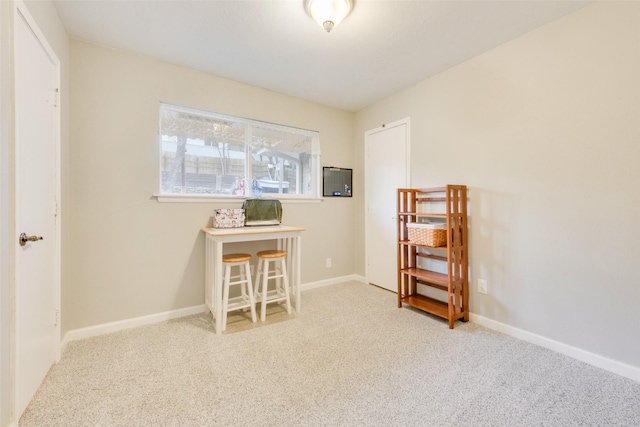 home office with carpet flooring