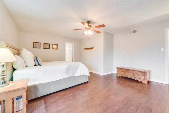 bedroom with ceiling fan and dark hardwood / wood-style floors