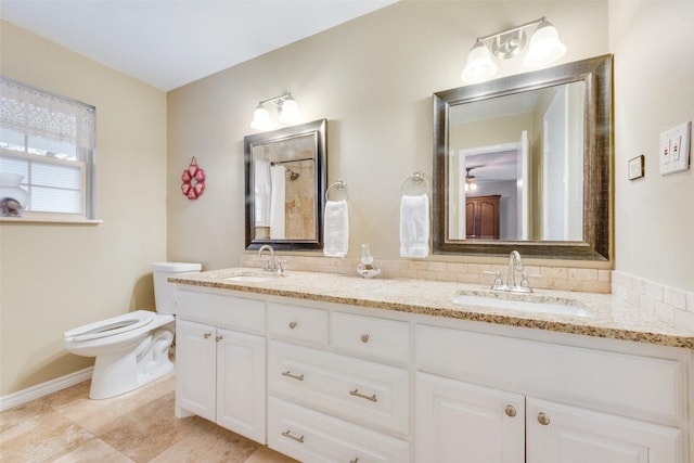 bathroom with toilet and vanity