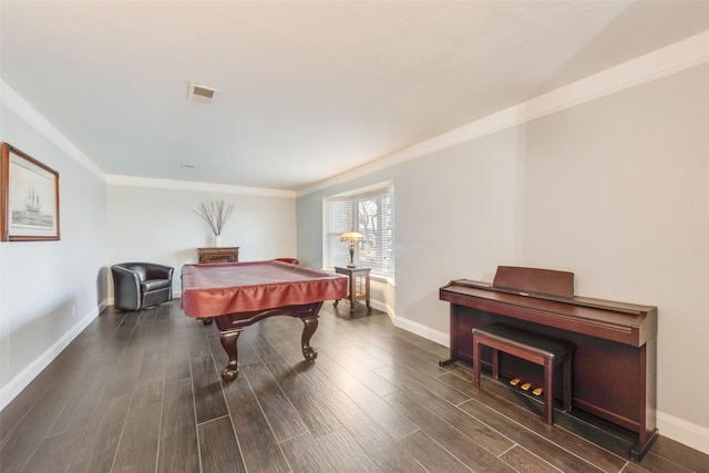 rec room featuring ornamental molding, pool table, and dark hardwood / wood-style flooring