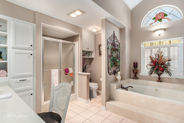 full bathroom featuring toilet, shower with separate bathtub, tile patterned floors, and vanity