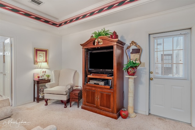 living area with light carpet and ornamental molding