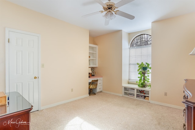 interior space with ceiling fan and carpet