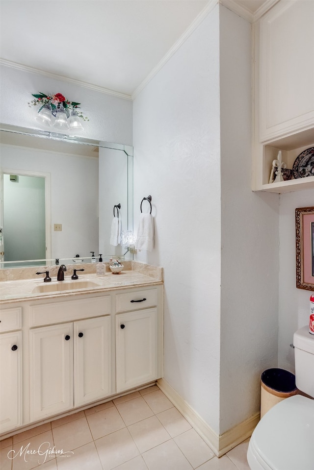 bathroom featuring toilet, vanity, tile patterned floors, and crown molding