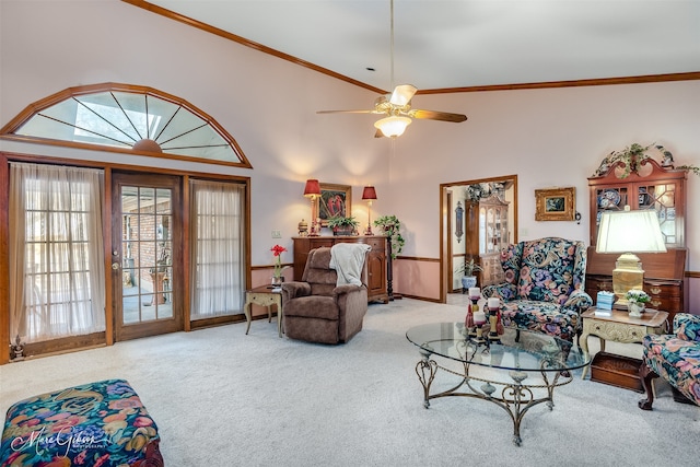 carpeted living room featuring ceiling fan and high vaulted ceiling