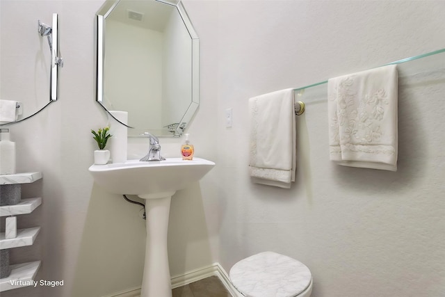 bathroom featuring toilet