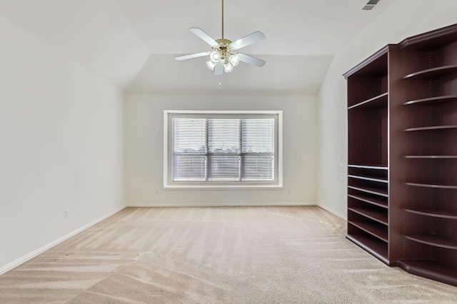 interior space featuring ceiling fan and lofted ceiling