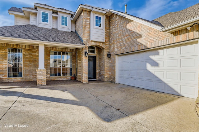 view of front of property with a garage