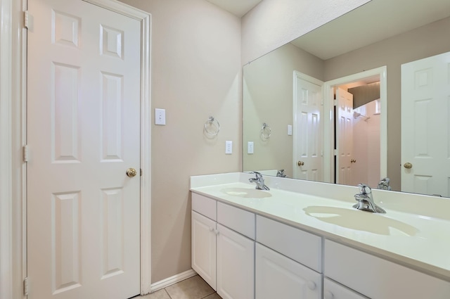 bathroom with vanity and tile patterned flooring