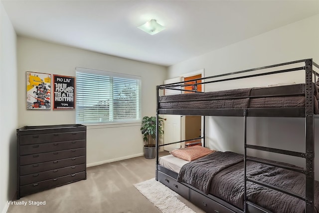 bedroom with light colored carpet