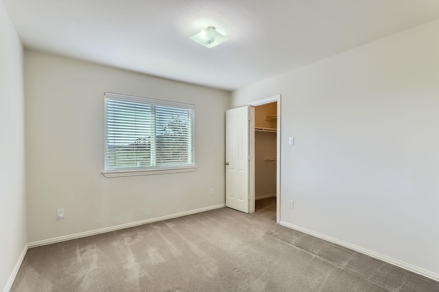 empty room featuring light carpet