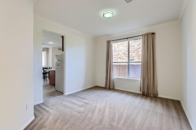 unfurnished room featuring light carpet, crown molding, and plenty of natural light