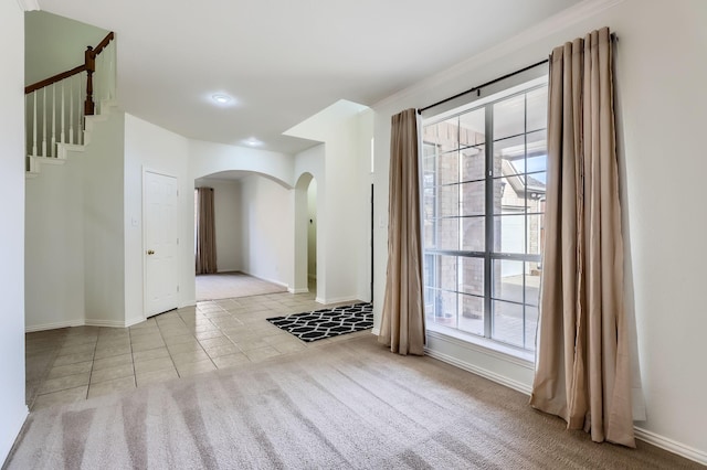 empty room featuring light colored carpet