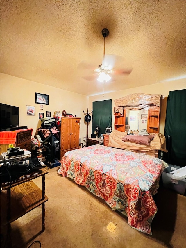 bedroom featuring ceiling fan and a textured ceiling