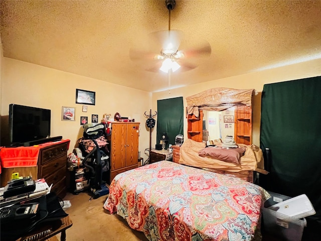 bedroom featuring ceiling fan and a textured ceiling