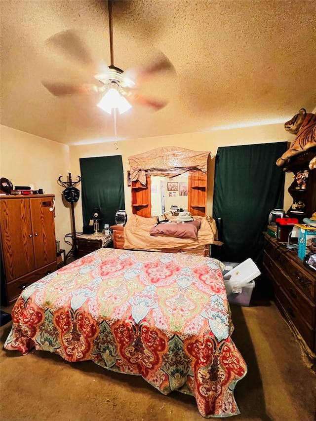 bedroom with ceiling fan and a textured ceiling