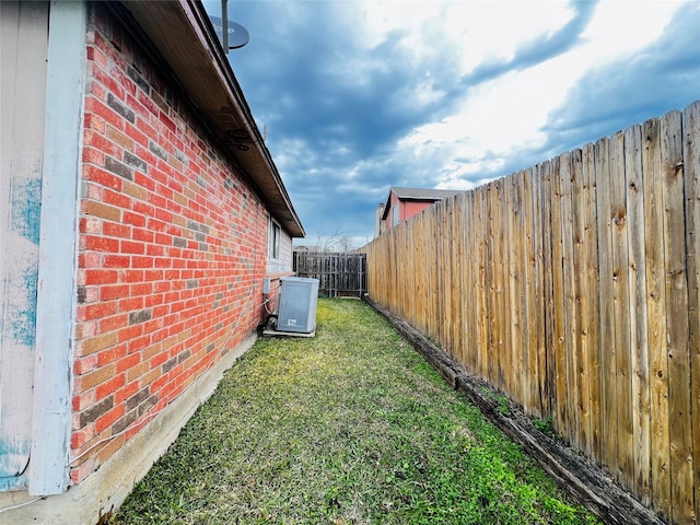 view of yard with central air condition unit