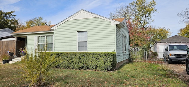 view of property exterior with a yard