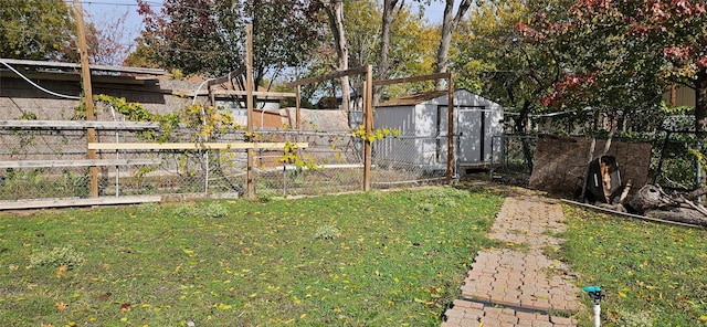 view of yard featuring a storage unit