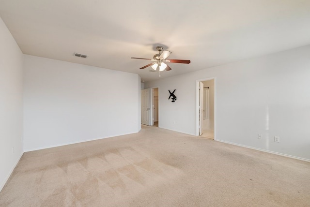 carpeted empty room featuring ceiling fan