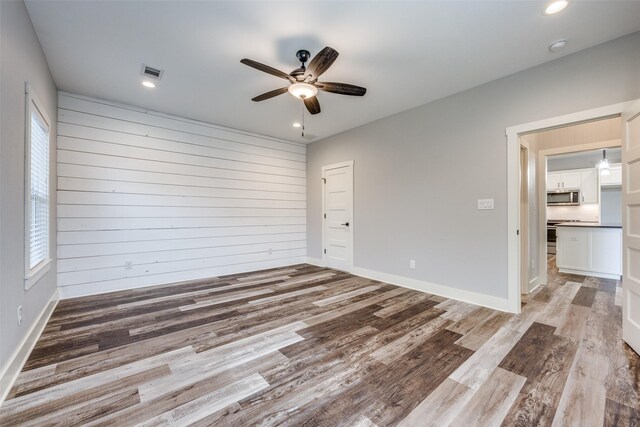 bathroom with a shower with shower door and vanity