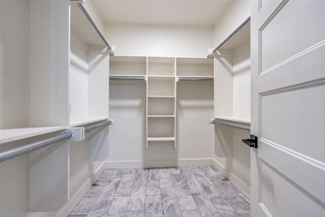 unfurnished bedroom with ceiling fan, a closet, and light carpet