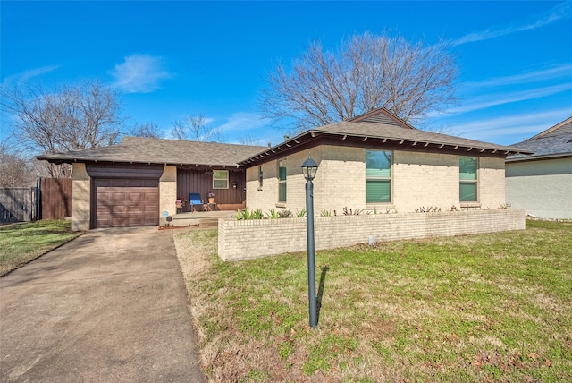 view of front facade with a garage and a front yard