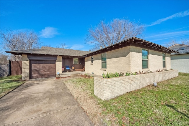 single story home with a garage and a front lawn