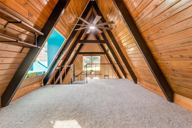 bonus room with wood walls, wooden ceiling, lofted ceiling with beams, and carpet flooring