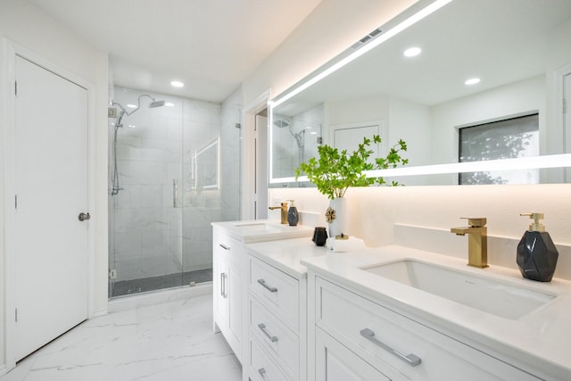 bathroom with walk in shower and vanity