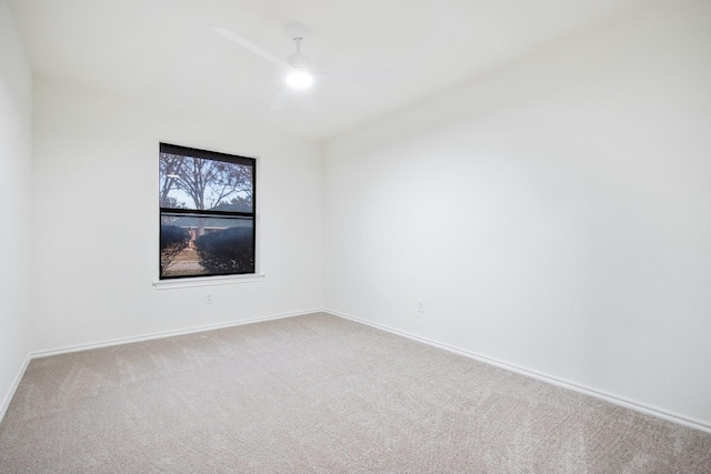 empty room with carpet and ceiling fan