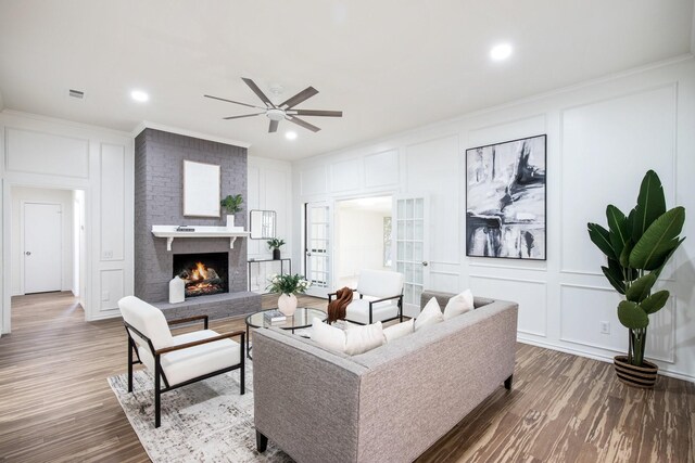 living room with ceiling fan and wood-type flooring