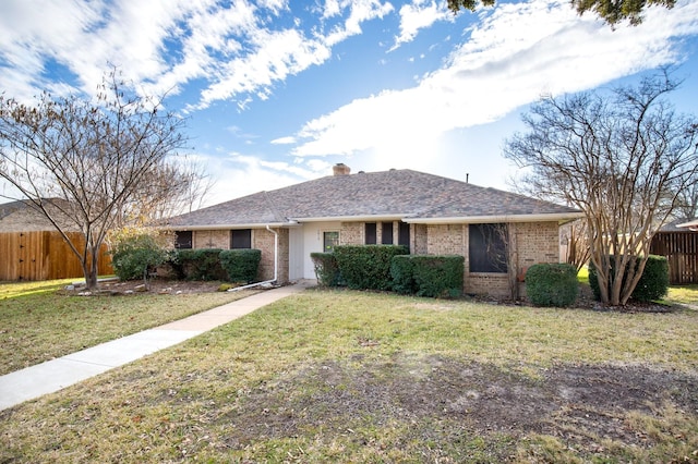 single story home featuring a front lawn