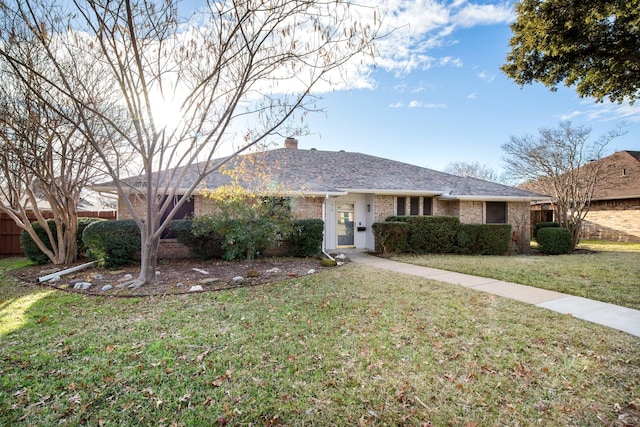 single story home with a front yard