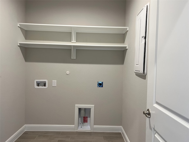 laundry area with hookup for a gas dryer, dark hardwood / wood-style flooring, hookup for a washing machine, and electric dryer hookup