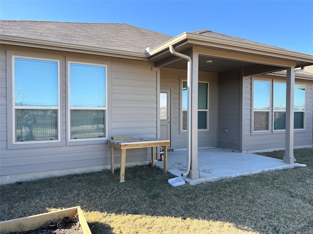 property entrance featuring a patio area