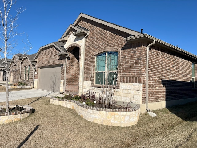 view of side of home with a yard