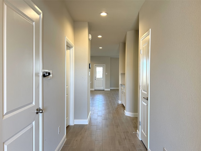 hall with light wood-type flooring