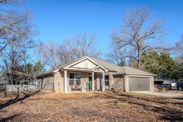 view of front of property featuring a porch and a garage