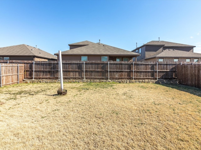 view of yard with a fenced backyard