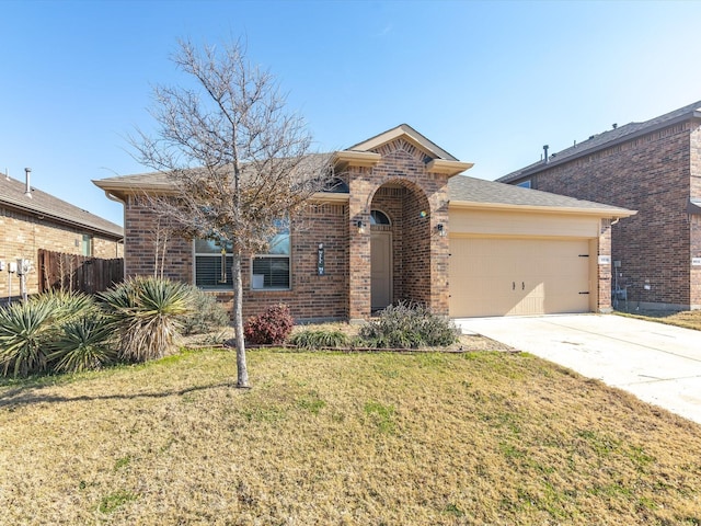 view of front of house featuring concrete driveway, brick siding, and a front yard