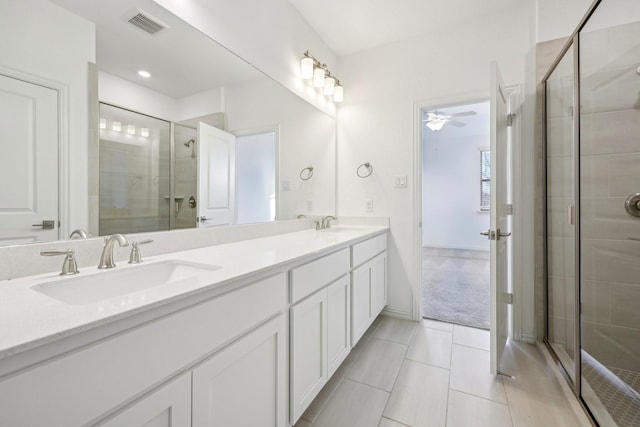 bathroom with ceiling fan, vanity, and an enclosed shower