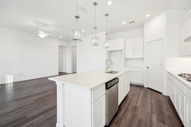 kitchen with sink, white cabinets, decorative backsplash, a kitchen island with sink, and stainless steel dishwasher