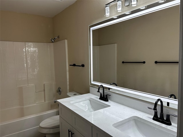 full bathroom featuring shower / bathing tub combination, vanity, and toilet