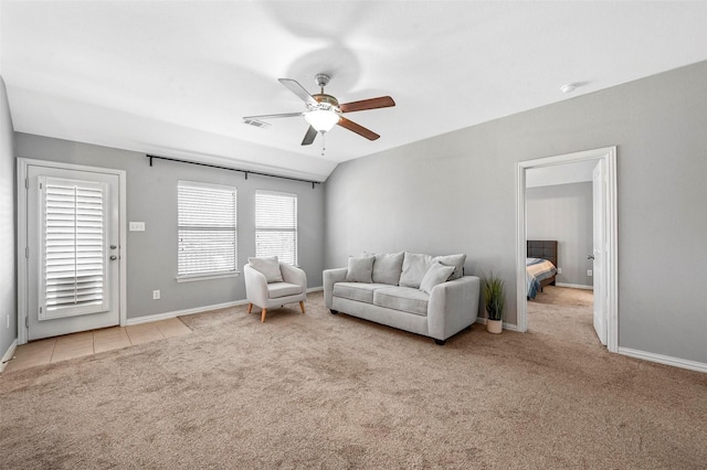 living room with ceiling fan and light colored carpet